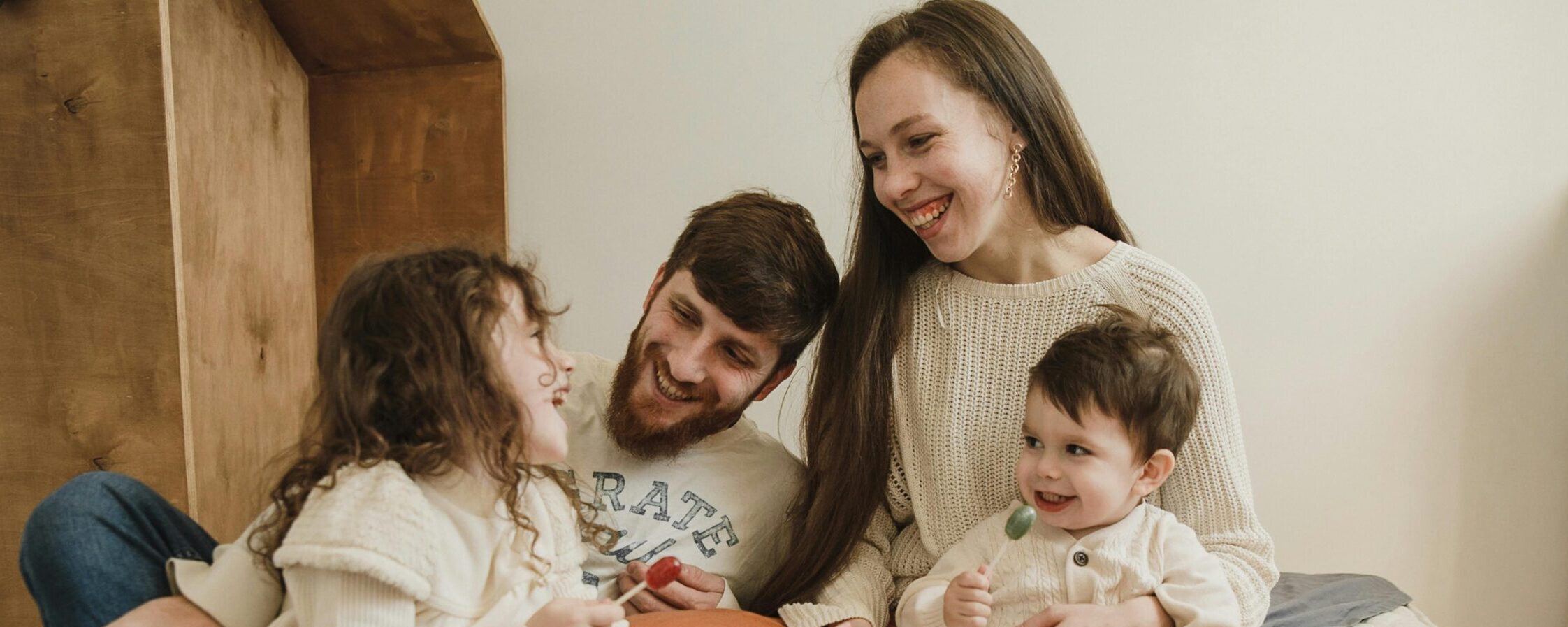 a family sits together in their living room