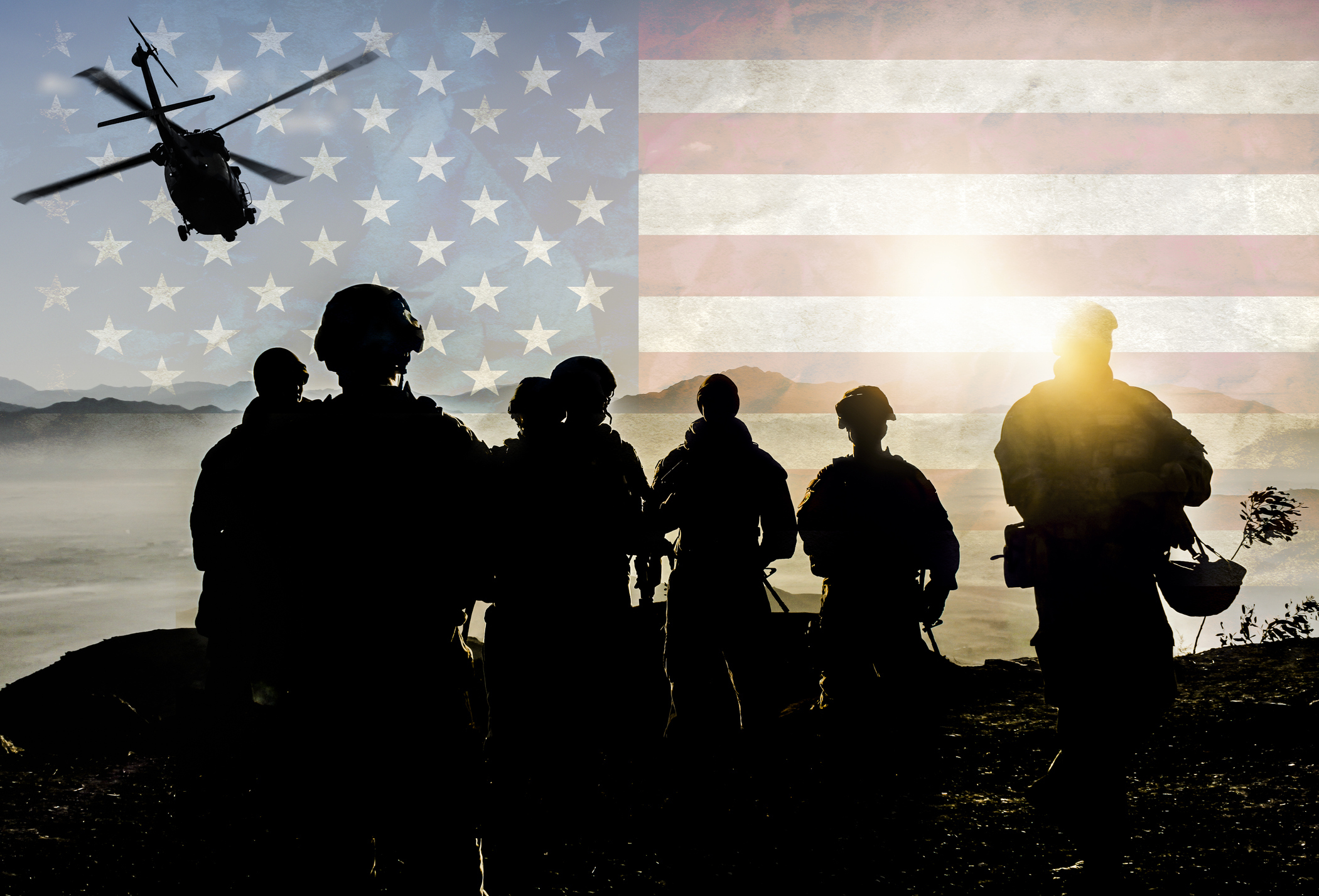 silhouette of solider during military mission again American flag